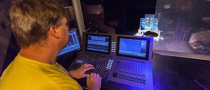 image of student operating lights for a play